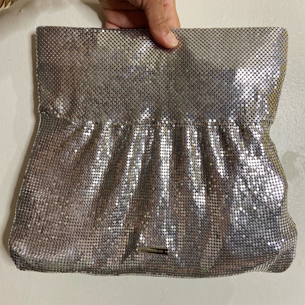 BCBGMaxAzria Metallic clutch, foldable with zipper.